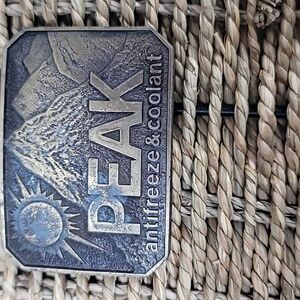 Peak antifreeze & coolant vintage belt buckle
